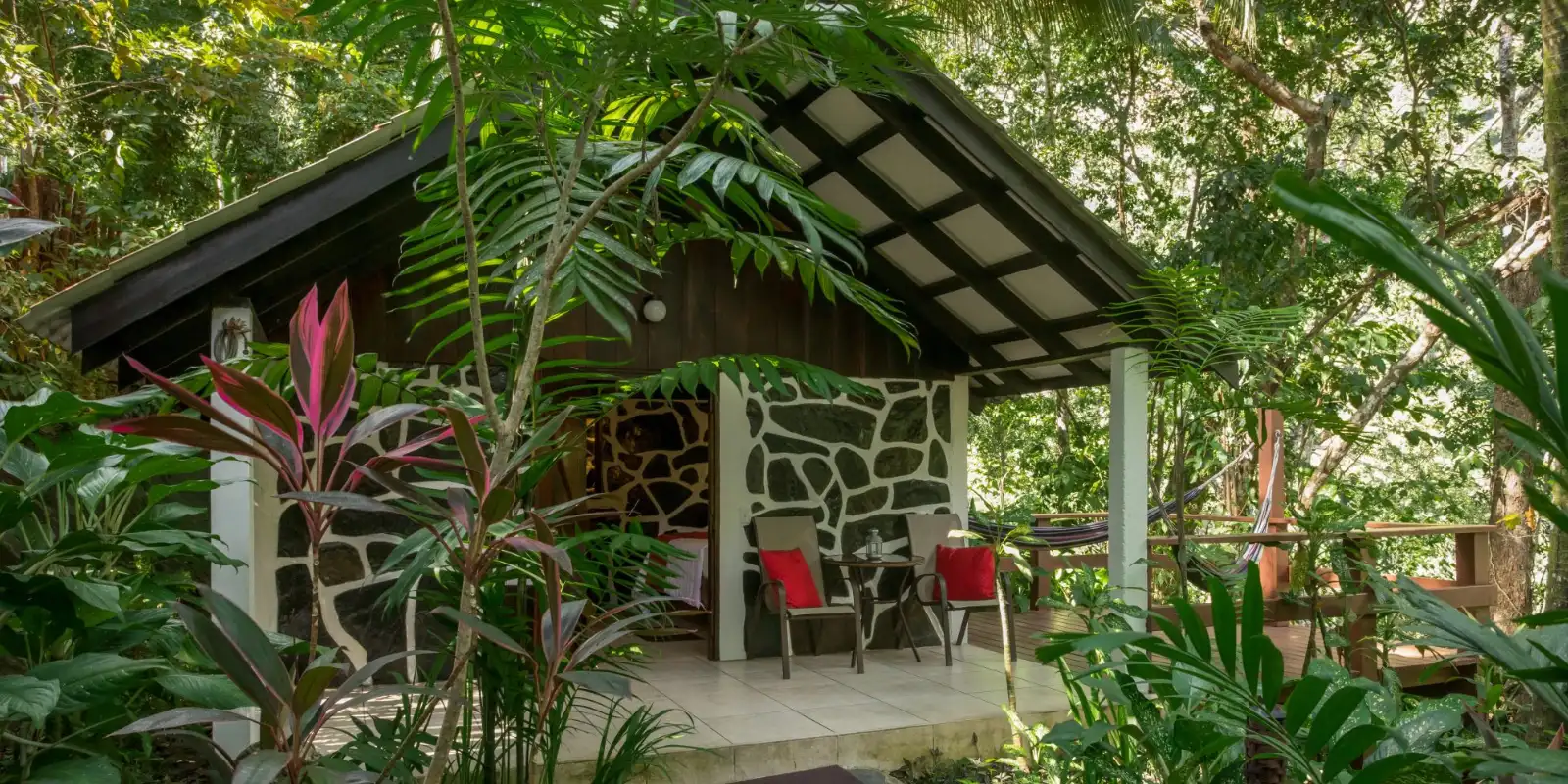 External view of a classic cabin at Black Rock Lodge, Belize.
