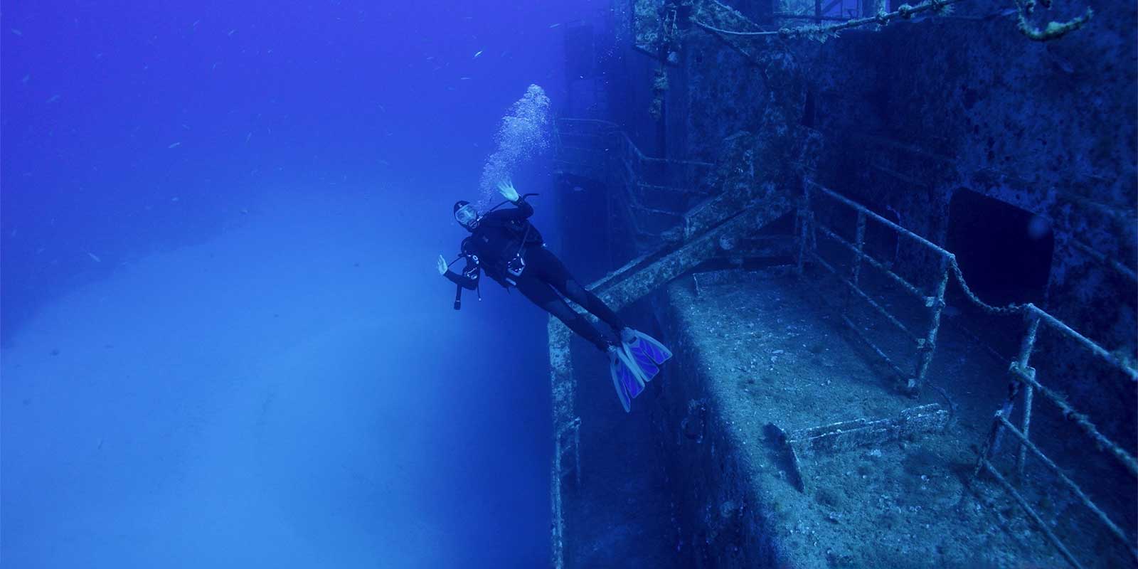 Diver exploring a wreck in Madeira