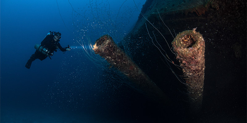 Wreck and diver in Bikini Atoll, the Marshall Islands.