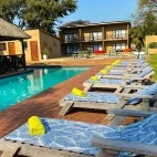The pool area at Agulhas House, complete with sun loungers.