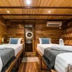 View of the deluxe stateroom with twin beds, on Komodo Aggressor, Indonesia.