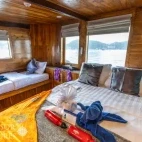 A master cabin with queen and single bed, on Komodo Aggressor, Indonesia.