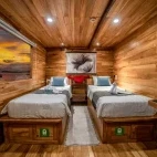 A master cabin with twin beds, on Komodo Aggressor, Indonesia.