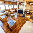 View of the saloon lounge area on Komodo Aggressor, Indonesia.
