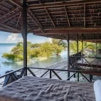 Beach bungalow terrace at Nunukan Island Resort. Indonesia.
