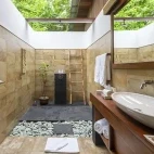 Garden view villa bathroom at Siladen Resort & Spa in Indonesia