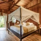 Garden view villa bedroom at Siladen Resort & Spa in Indonesia