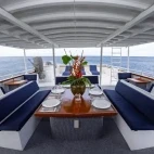Upper deck dining area on board Atlantis Adventurer liveaboard in the Philippines.