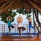 Treetop yoga at Atmosphere Resort & Spa. Holiday accommodation in Dauin, Philippines.