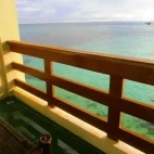 Room terrace at Blue Corals Beach Resort in Malapascua, the Philippines, overlooking the sea.