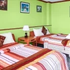 Twin sea view room at Blue Corals Bech Resort in Malapascua, the Philippines, with large beds