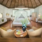 View of a Beach Villa bedroom, at Coco Palm Dhuni Kolhu Resort, Maldives