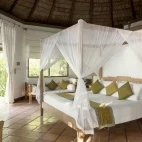 A Deluxe Villa bedroom at Coco Palm Dhuni Kolhu Resort, Maldives