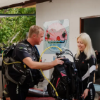 Divers kitting up at Diverland Dive Centre, Embudu Village Maldives.