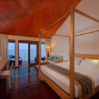 Interior view of an overwater villa at Embudu Village, Maldives.