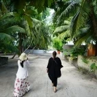 Women walking together in the Maldives.