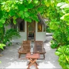 External view of one of Makunudu Island Resort's beach bungalows.