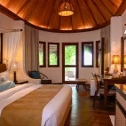 Stylish interior of a bungalow at Makunudu Island Resort.