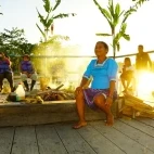 Local woman by a campfire at  Napo Cultural Centre Lodge, Ecuador.