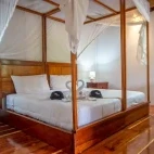 View of the double bed in the mini suite room at  Napo Cultural Centre Lodge, Ecuador.