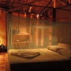 Bungalow bedroom at Sanbis Island Resort in the Solomon Islands