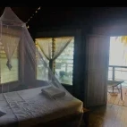 Bungalow bedroom at Sanbis Island Resort in the Solomon Islands