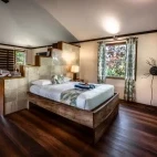 Garden bure bedroom at Beqa Lagoon Resort in Fiji.