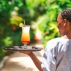 Staff member at the hotel restaurant, Sunshine Bay Beach Hotel, Zanzibar