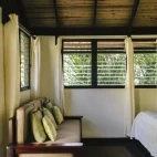 Seating area in a bedroom at Black Rock Lodge, Belize.
