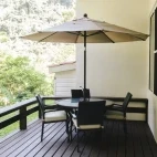 External view of the private seating of a forest cabin, at Black Rock Lodge, Belize.