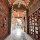 Hallway leading to the communal lounge and swimming pool at Villa Carey.