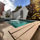Decking level view of the swimming pool at Villa Carey in La Paz.