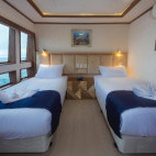 Main deck twin cabin on board Tiburon Explorer liveaboard in the Galapagos Islands