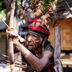 Indonesian indigenous tribesman  with bow and arrow.