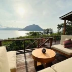 The relaxing bar lounge area at Alor Tanapi Dive Resort, complete with ocean views.