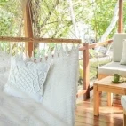 The private terrace off of the oceanfront room, complete with lounge chairs and hammock.