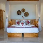 Premium oceanfront cottage bedroom at Murex Bangka, Indonesia.