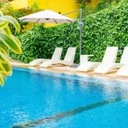 View of the poolside at Buceo Anilao Beach & Dive Resort, Philippines.
