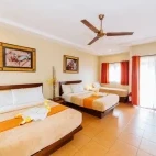 The sea view deluxe cabana, with two double beds and one single bed, at Buceo Anilao Beach & Dive Resort, Philippines. 