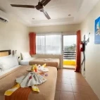 Example of the sea view superior room, with one double and one single bed, and balcony. Available at Buceo Anilao Beach & Dive Resort, Philippines.