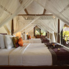Garden view bedroom at Alam Anda Ocean Front Resort & Spa in Bali, Indonesia.
