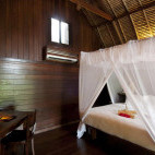 Lumbung suite bedroom at Naya Gawana in Bali, Indonesia