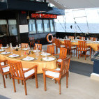 Outdoor dining on board Dewi Nusantara liveaboard in Indonesia
