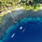 Aerial of Sali Bay Resort and house reef in Indonesia