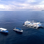 Atmosphere Resort & Spa boats at sea in Dauin, Philippines.