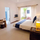 Apartment bedroom at Atmosphere Resort & Spa. Holiday accommodation in Dauin, Philippines.