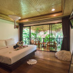 Deluxe garden loft bedroom at Long Beach Chalet in Koh Lanta, Thailand