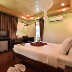 Standard garden loft bedroom at Long Beach Chalet in Koh Lanta, Thailand