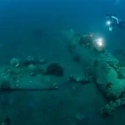 Diver & wreck in Papua New Guinea.