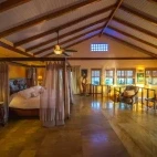 View of a bedroom in a premier villa, at Chabil Mar Villas, Belize.